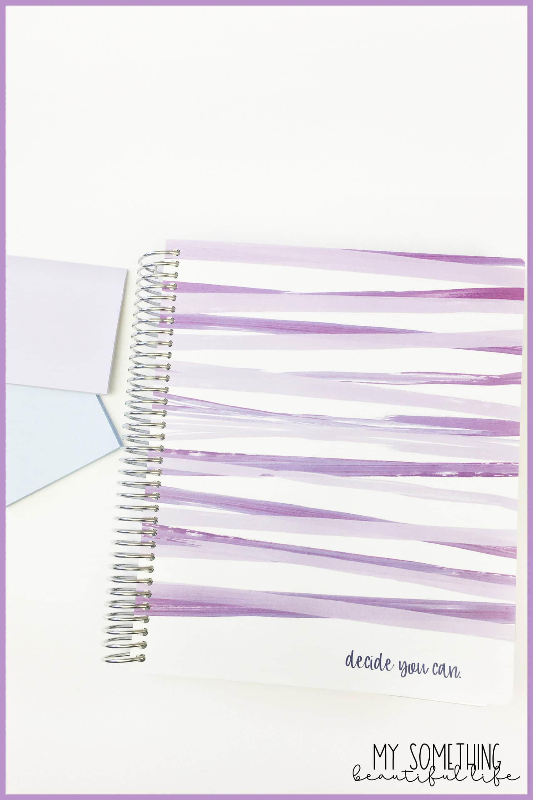 Plum paper planner with two sticky note pads