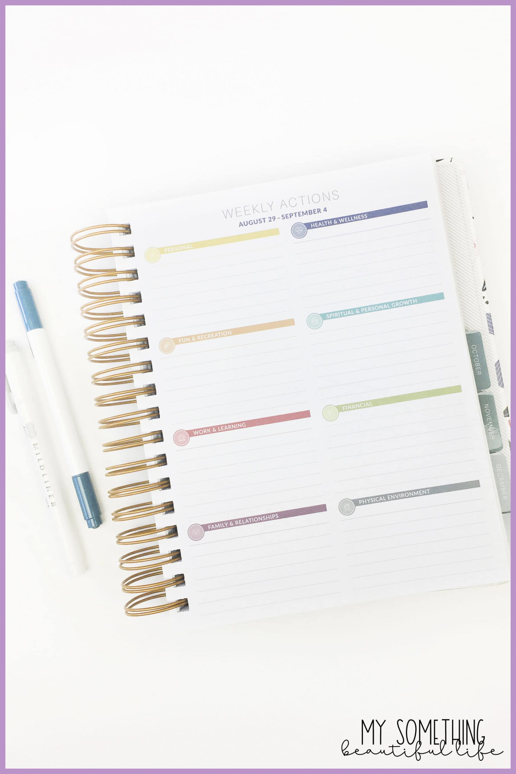 interior goal page of the MakseLife Planner and two pens